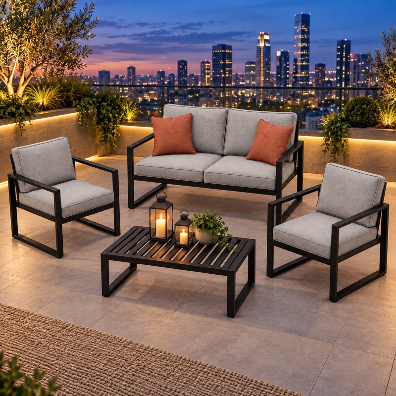 Conjunto lounge de jardín de acero, con cojines en una azotea al anochecer