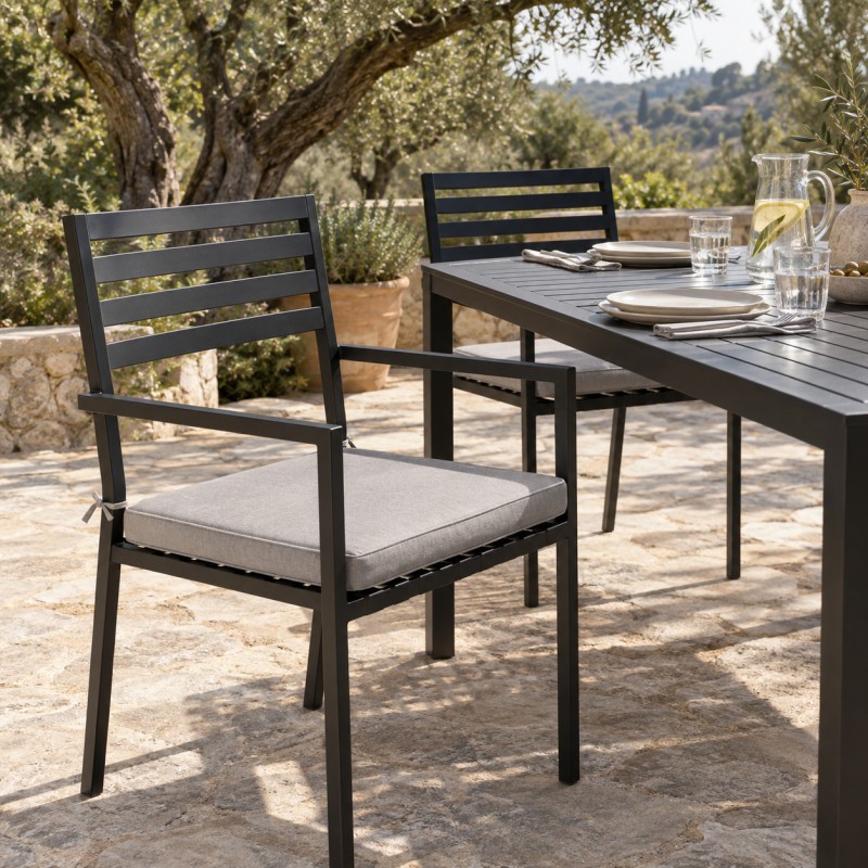 Outdoor Seat Pad for the Steel Garden Dining Chair, on two garden dining chairs at the table